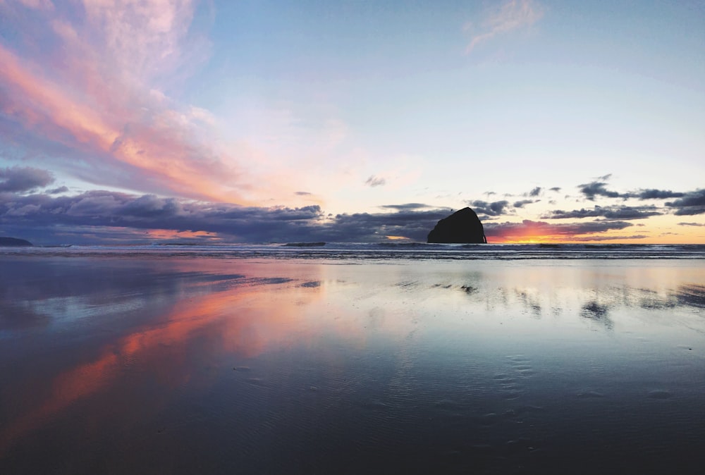 body of water at golden hour