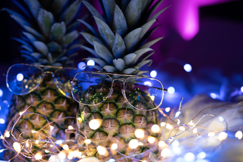 two pineapples with eyeglasses