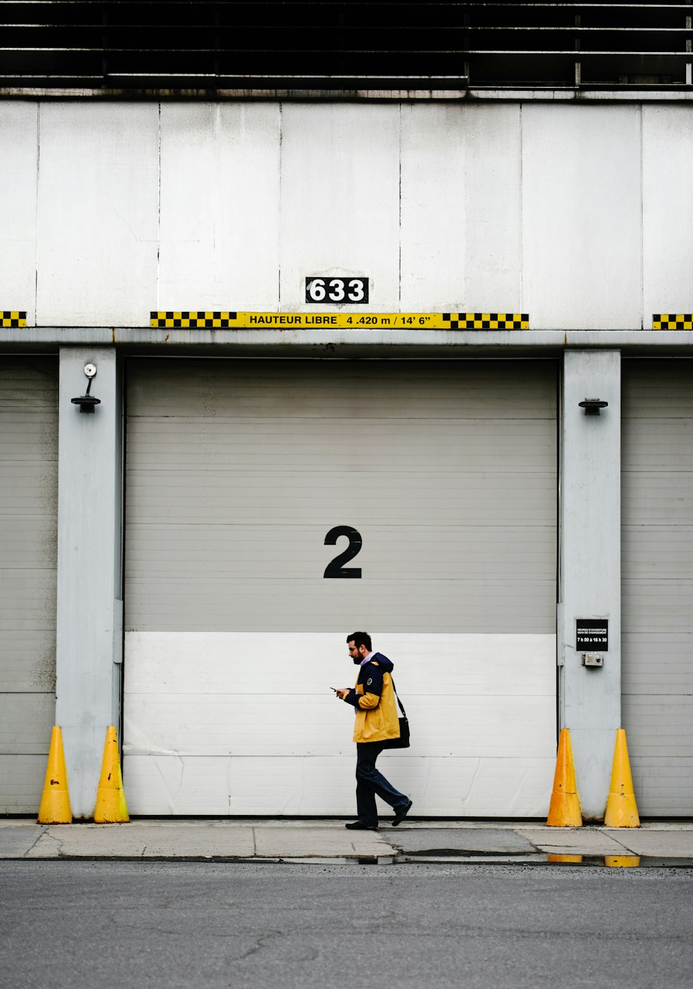 person walking past roll-up door