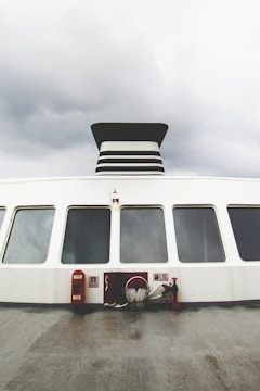 Exterior view of a Holbox Express ferry with visible insulation work