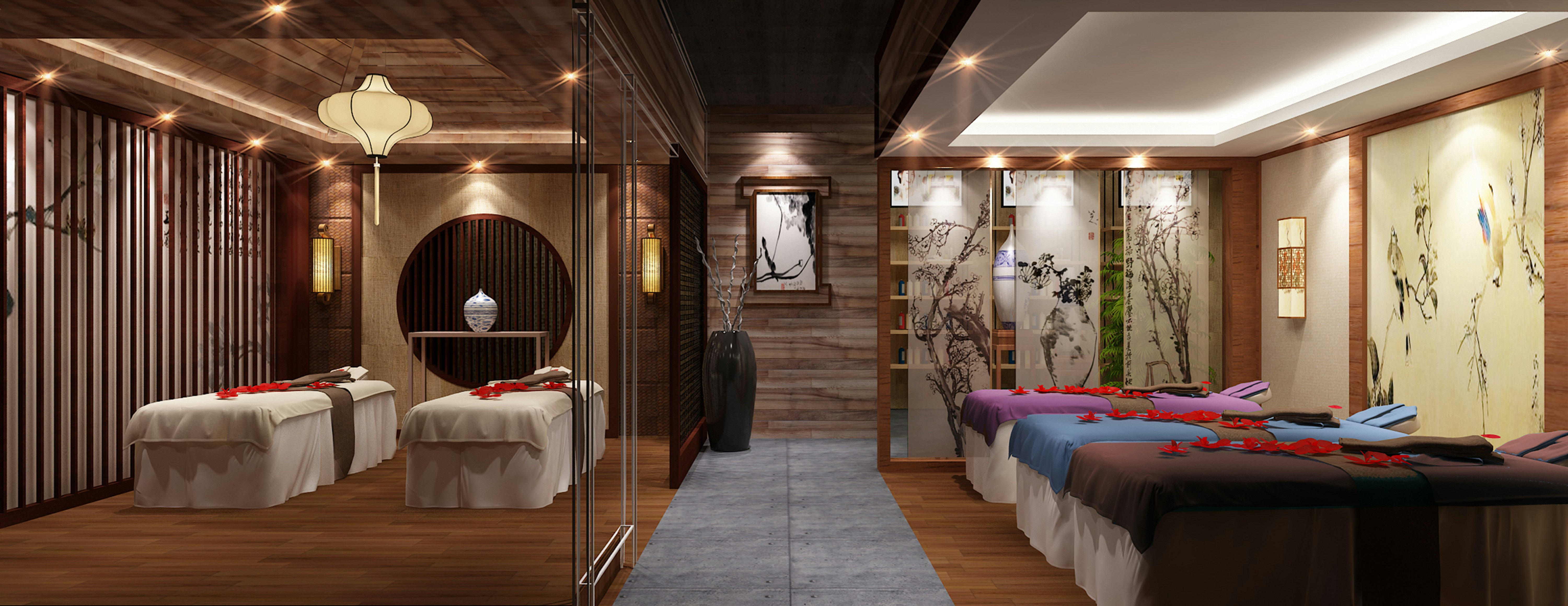 Serene spa treatment room with massage bed, candles, and pink flower decorations