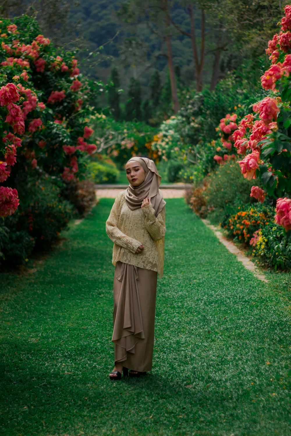 woman standing on green grass