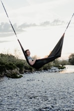 man lying on hammock