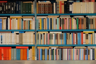 assorted-title pile of books on shelf