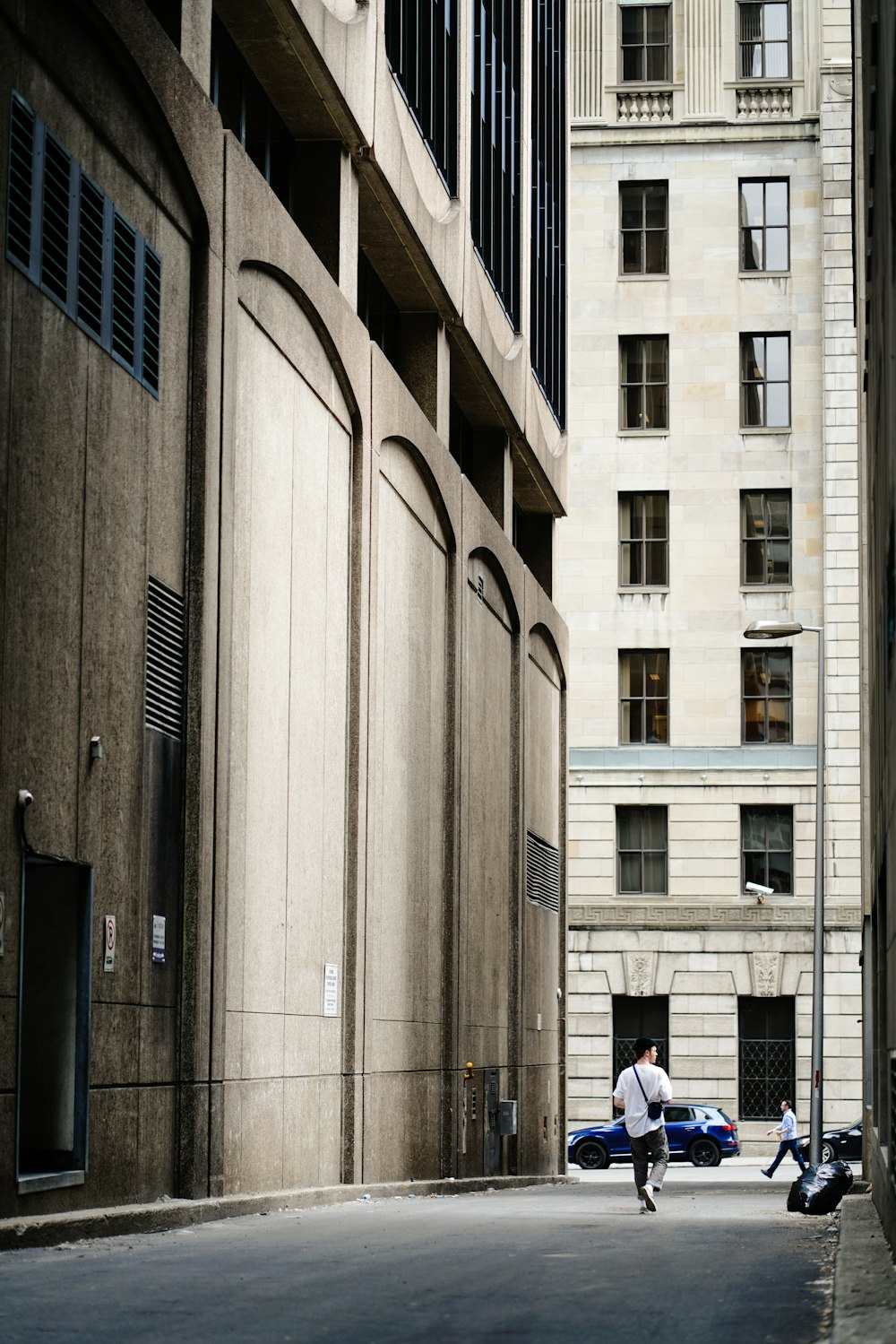 man walking on the street during daytime