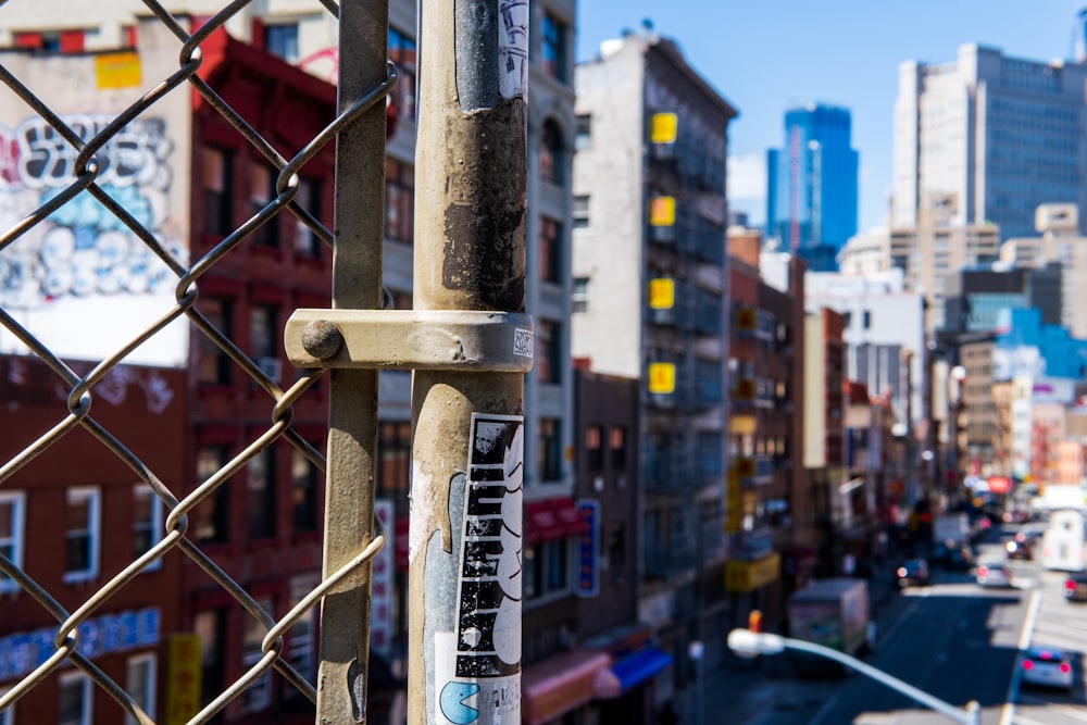 shallow focus photography of brown steel cyclone fence