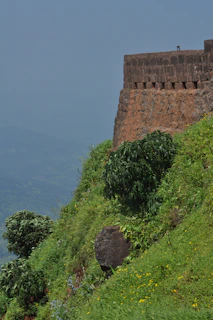 View of the fortified walls and lush greenery surrounding the gîte at Espalion.
