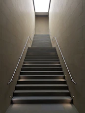 gray concrete stair with gray steel handle