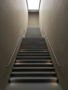 gray concrete stair with gray steel handle