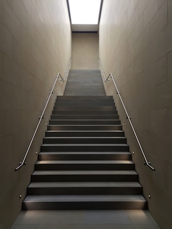 gray concrete stair with gray steel handle