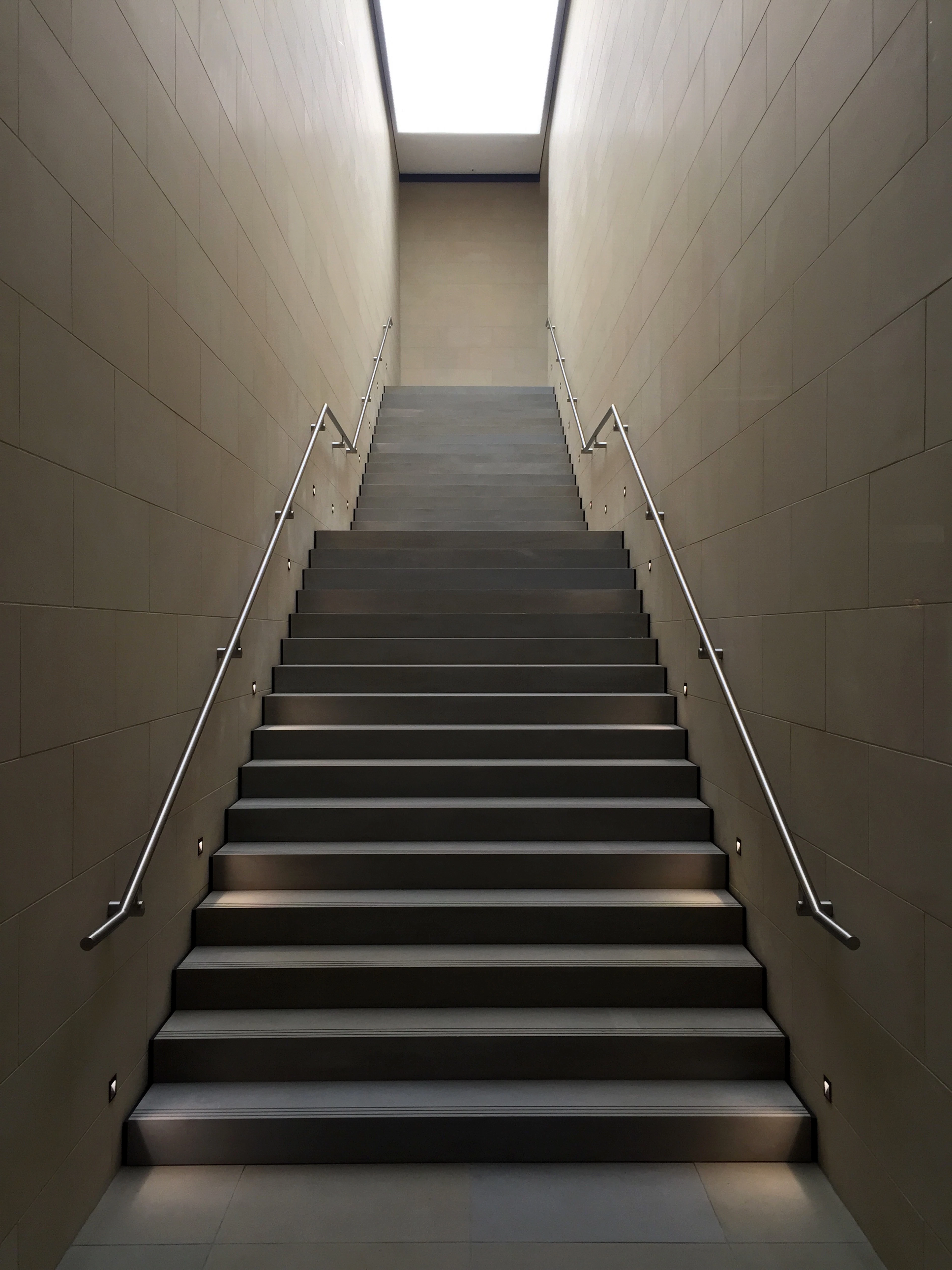 Staircase with a steel handrail