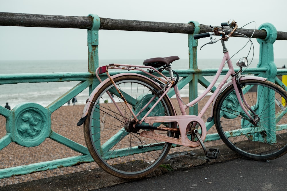 white cruiser bike near railings