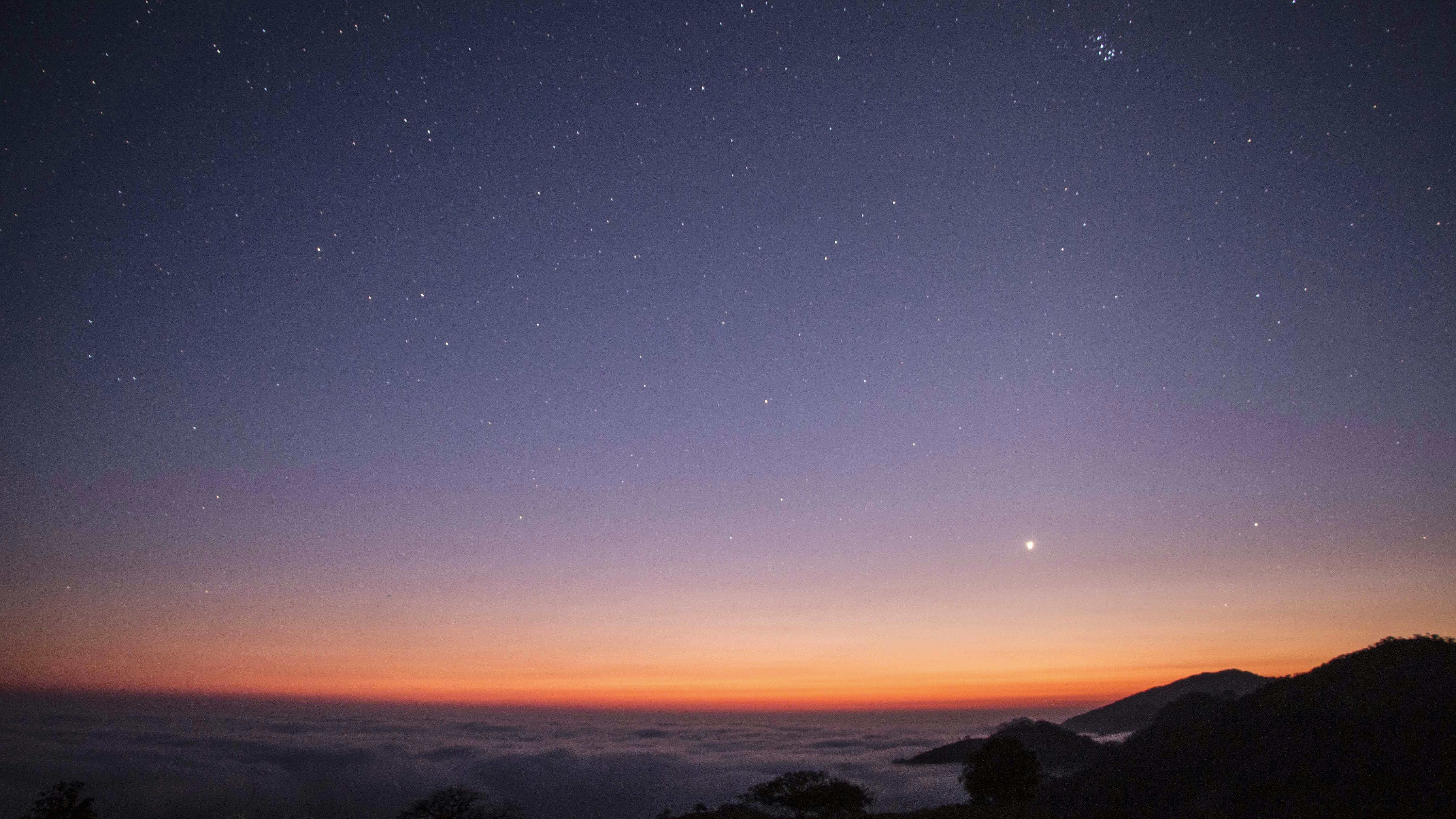 body of water during sunset