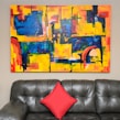 Custom wall art hanging above a stylish living room sofa.