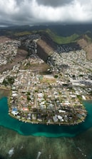 aerial view of houses on mountain and lake