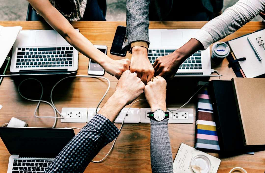 group of people doing fist bumps