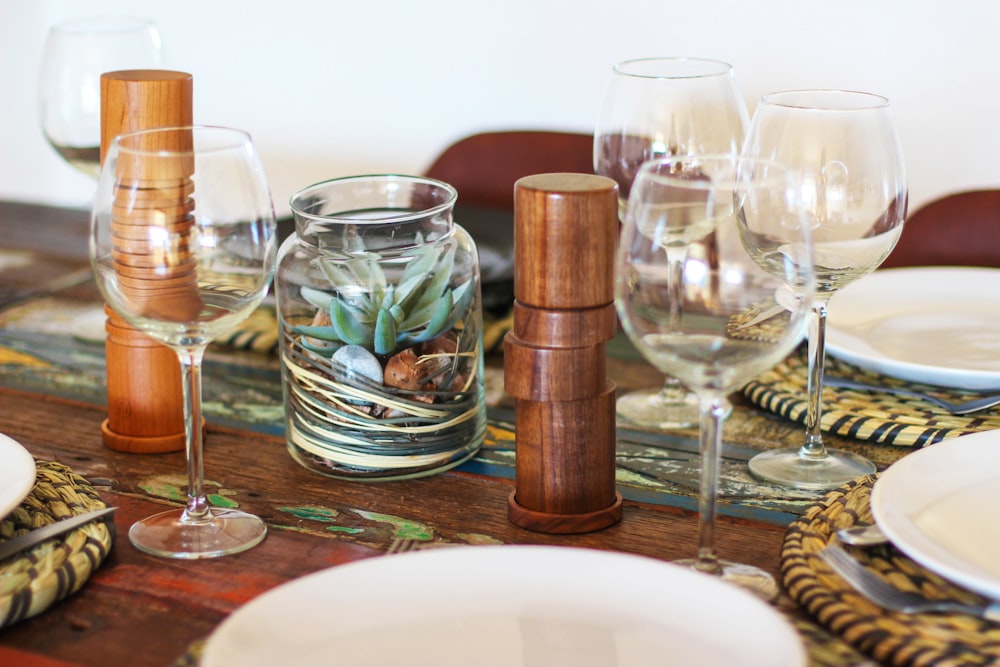 five clear wine glasses on table