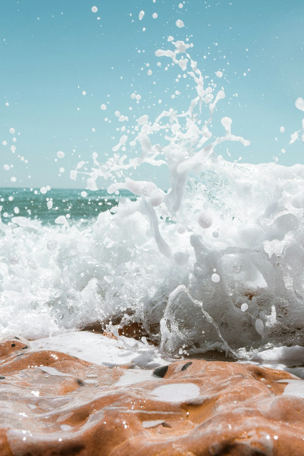 splash of water on brown textile