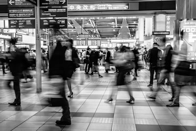 timelapse photography of people walking busy google meet background