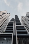low-angle photography of black painted high-rise building