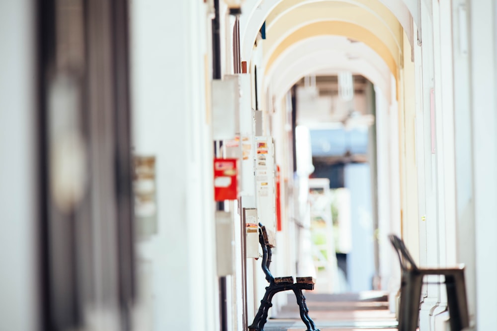 wooden bench placed on corridor