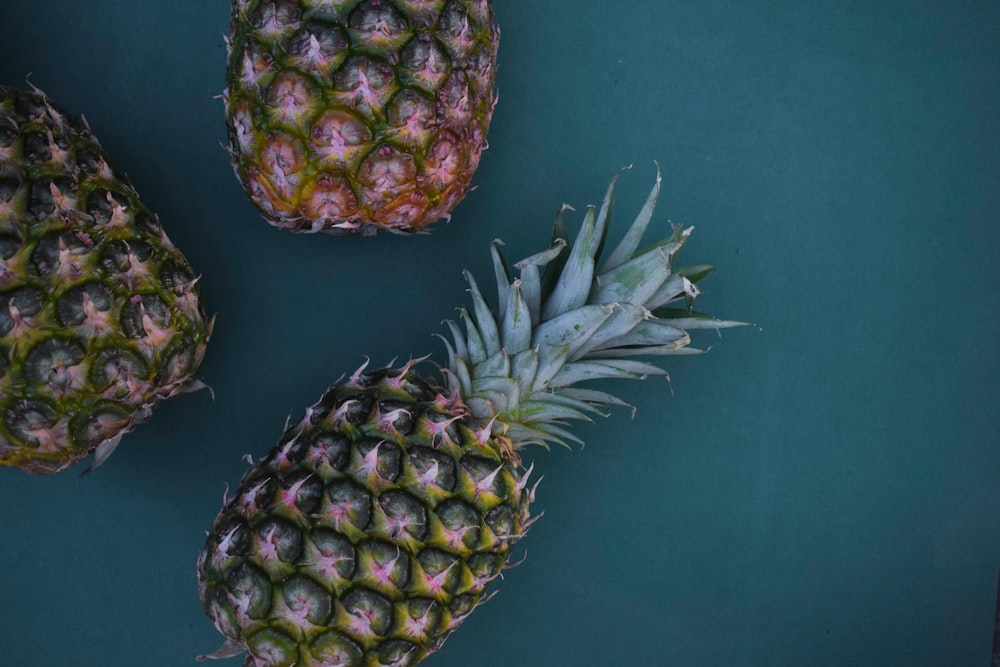 flat-lay photography of three pineapples