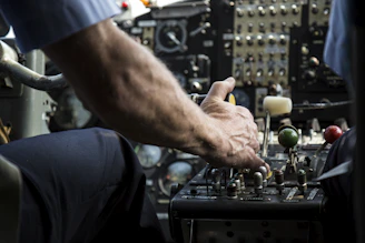 Close-up of a hand smoothly operating a sleek robotic control panel with metallic accents.