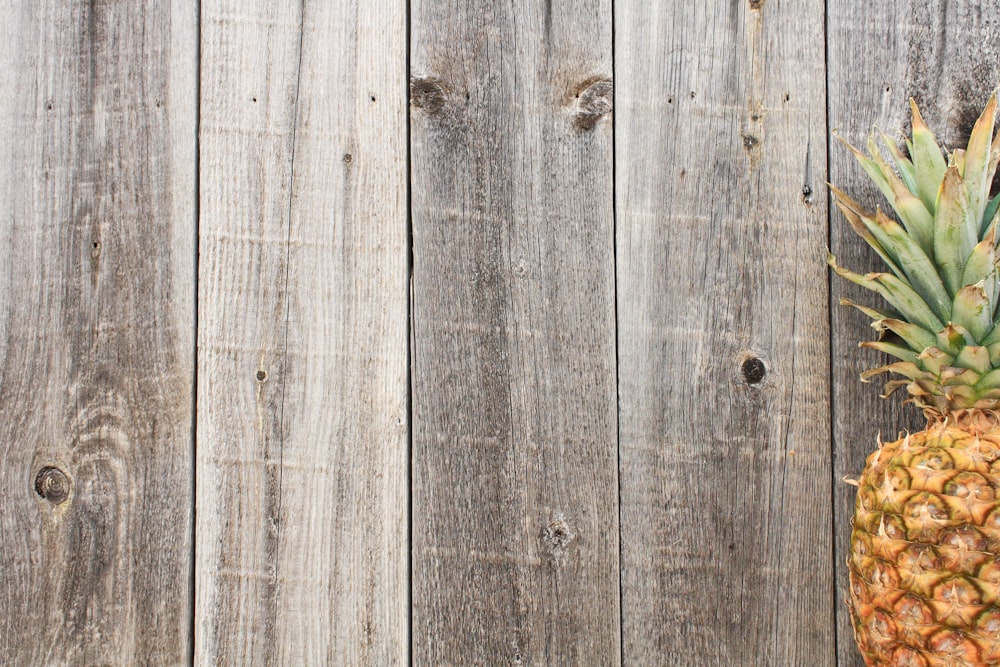 pineapple on gray wooden surface