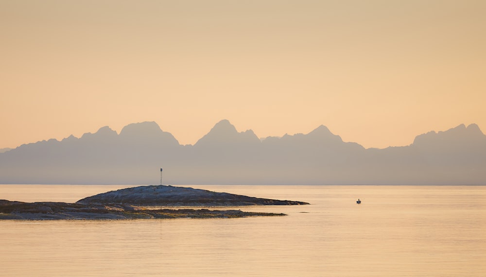 islet near mountain range