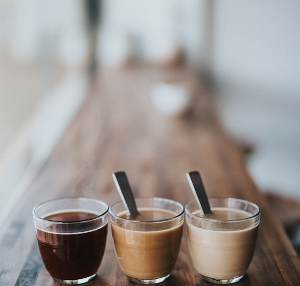 macro photography of three assorted liquids