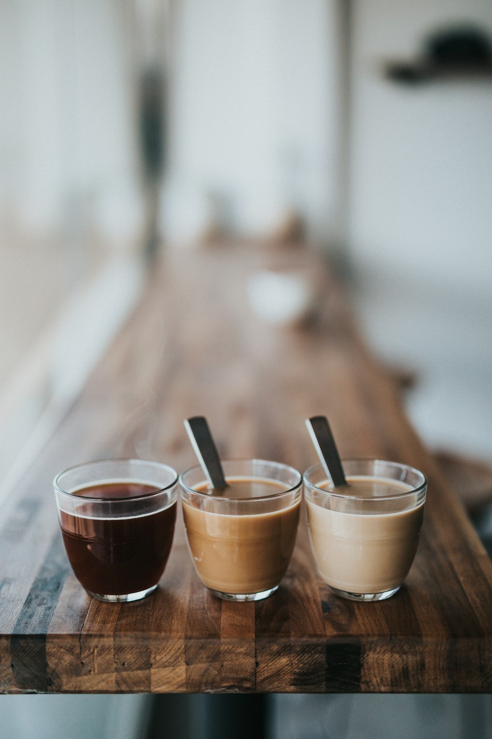 macro photography of three assorted liquids