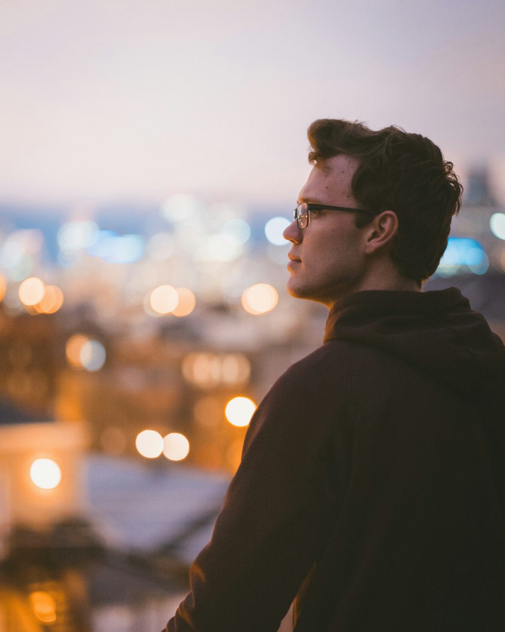 man standing wearing black hoodie