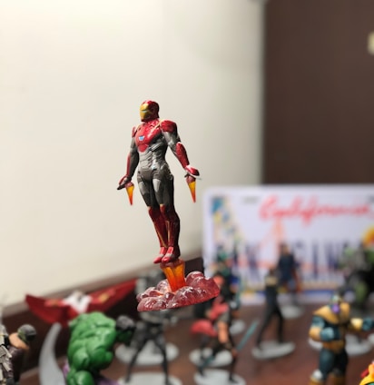 A vibrant collage featuring Superglue-Man, I-Woman, Bubblegum-Barbee, and Superrocket-Man in action poses against a futuristic city backdrop.