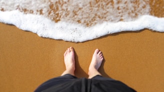 person standing at the edge of the shore