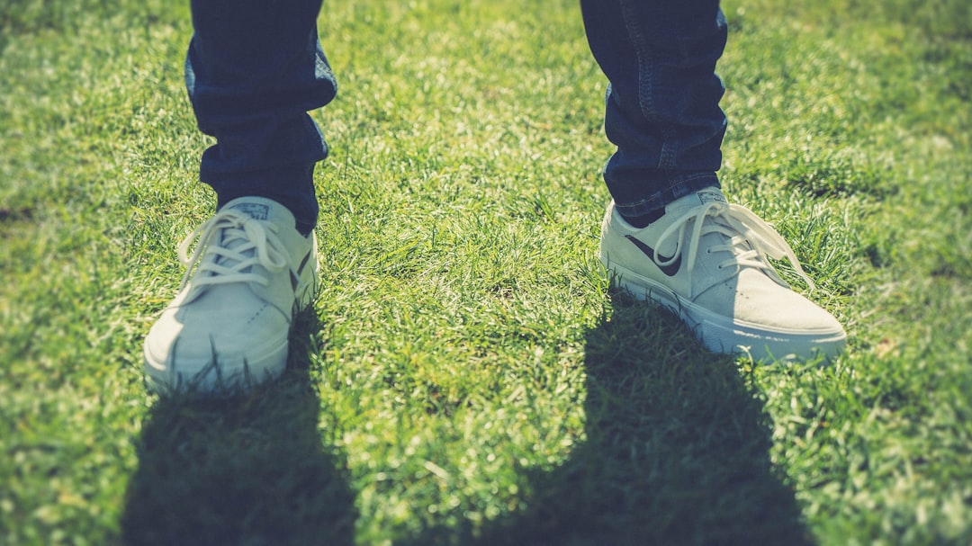 person standing on grass