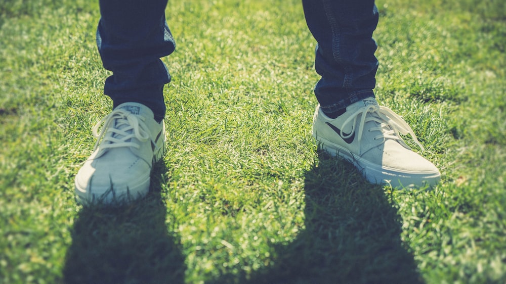 person standing on grass