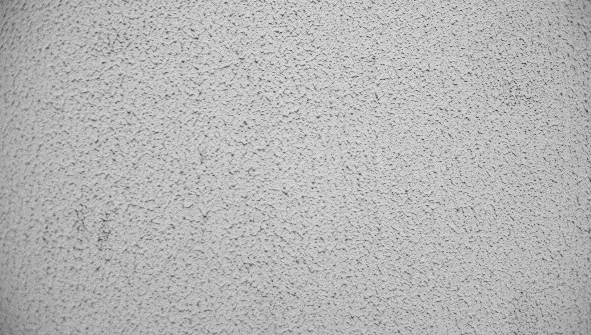 a black and white photo of a textured surface