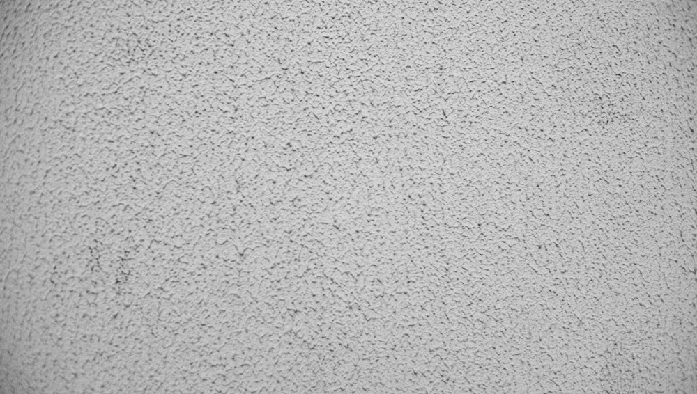 a black and white photo of a textured surface