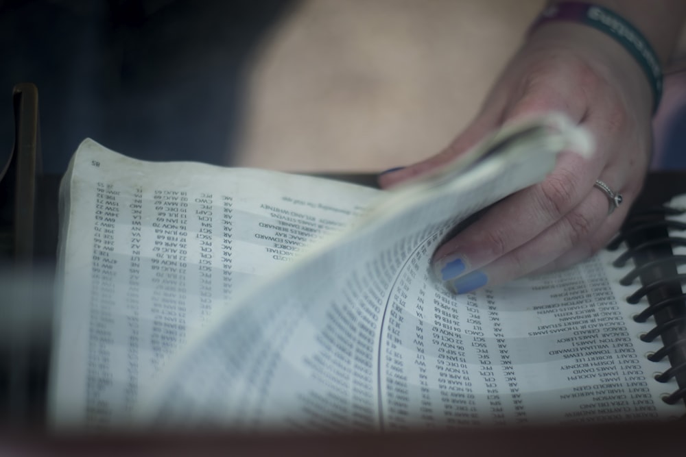 person's holding book