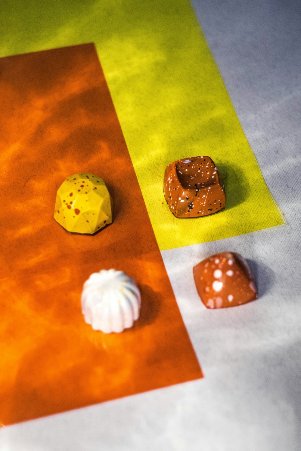 four assorted candies on top of white surface