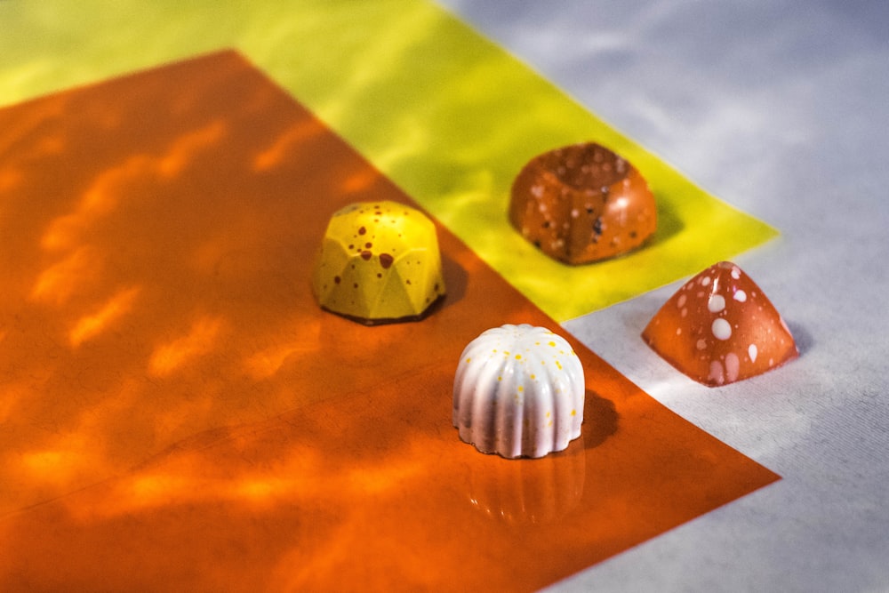 four assorted-shape chocolates