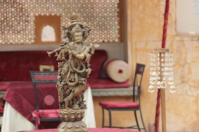 An elegant custom statue displayed in a bright, stylish living room.