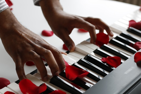 person playing electronic keyboard