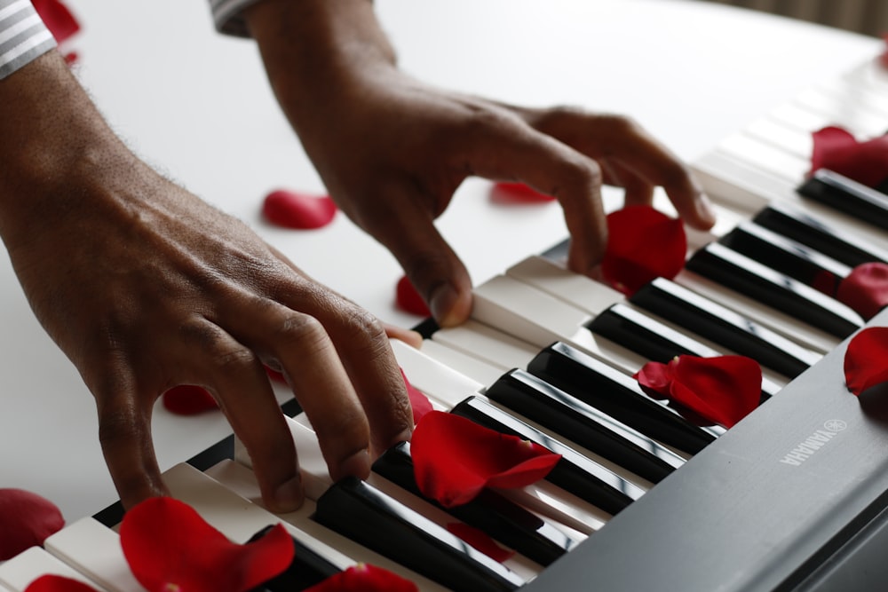 person playing electronic keyboard