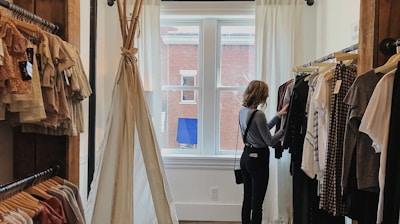 woman standing selecting clothes