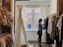 woman standing selecting clothes
