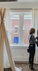 woman standing selecting clothes