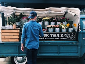 man facing flower truck