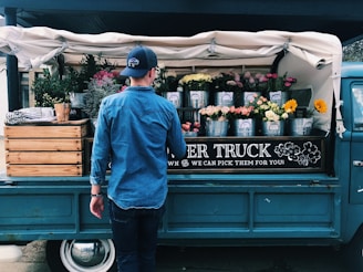 man facing flower truck