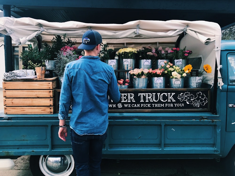 man facing flower truck